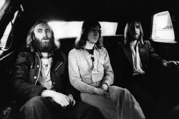 18th May 1977: British rock group Genesis, from left to right Phil Collins, Tony Banks and Mike Rutherford, in the back of a limousine on the way to the LA Forum where they are performing. (Photo by Graham Wood/Evening Standard/Getty Images)